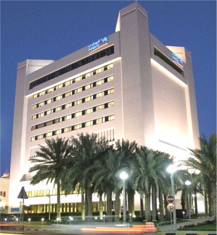 Historic National Bank of Kuwait headquarters at night