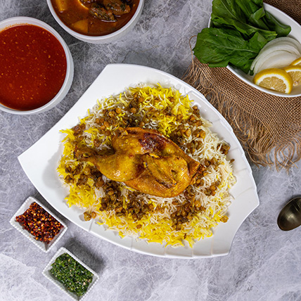 Kuwaiti chicken machboos served over spiced rice