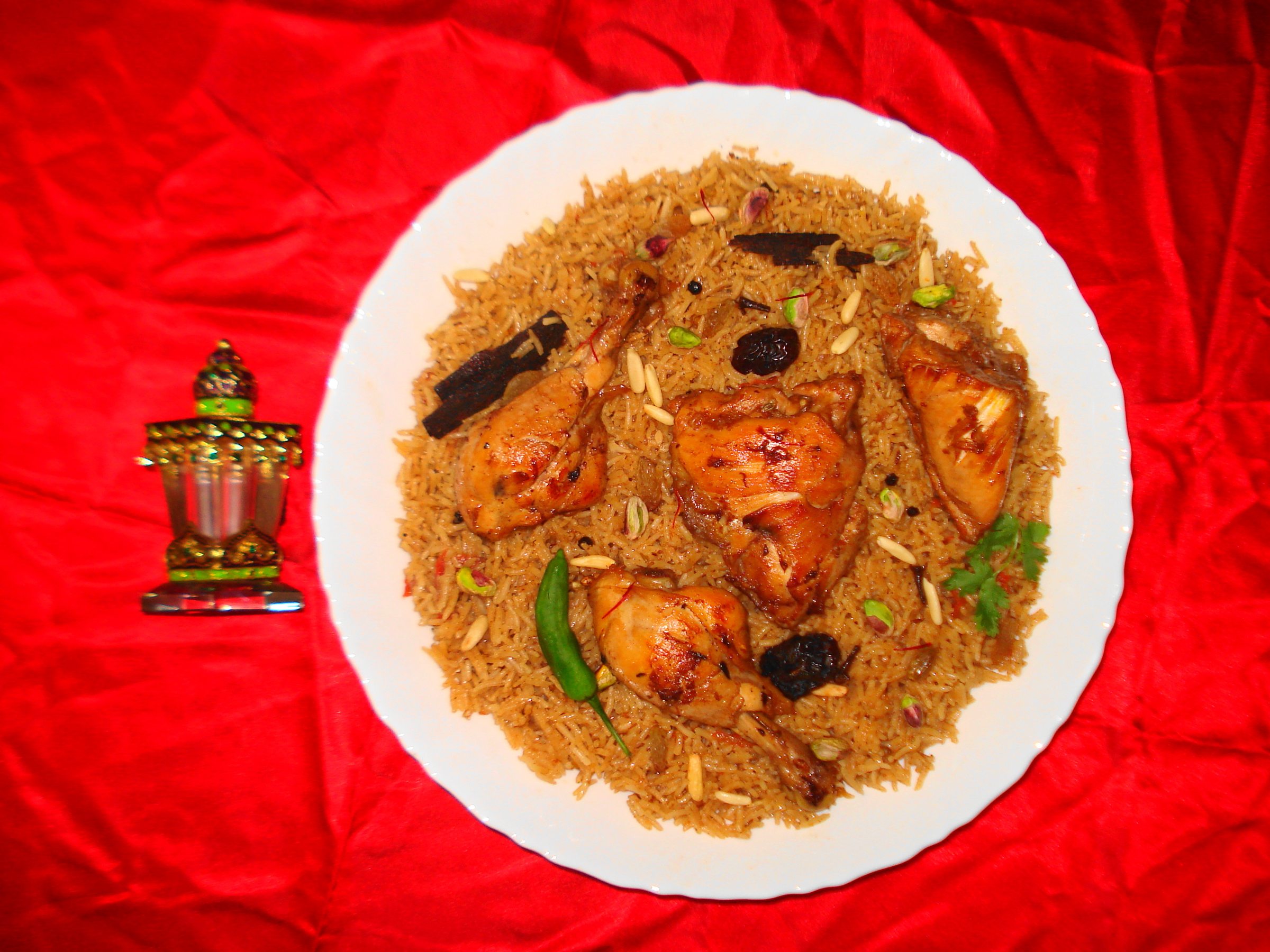 Large platter of chicken machboos with spiced rice