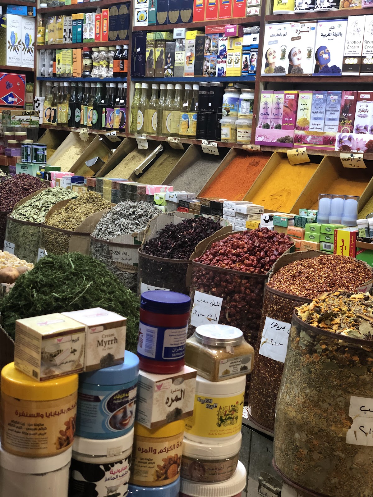 Colourful spice and herb display in Souq Al-Mubarakiya