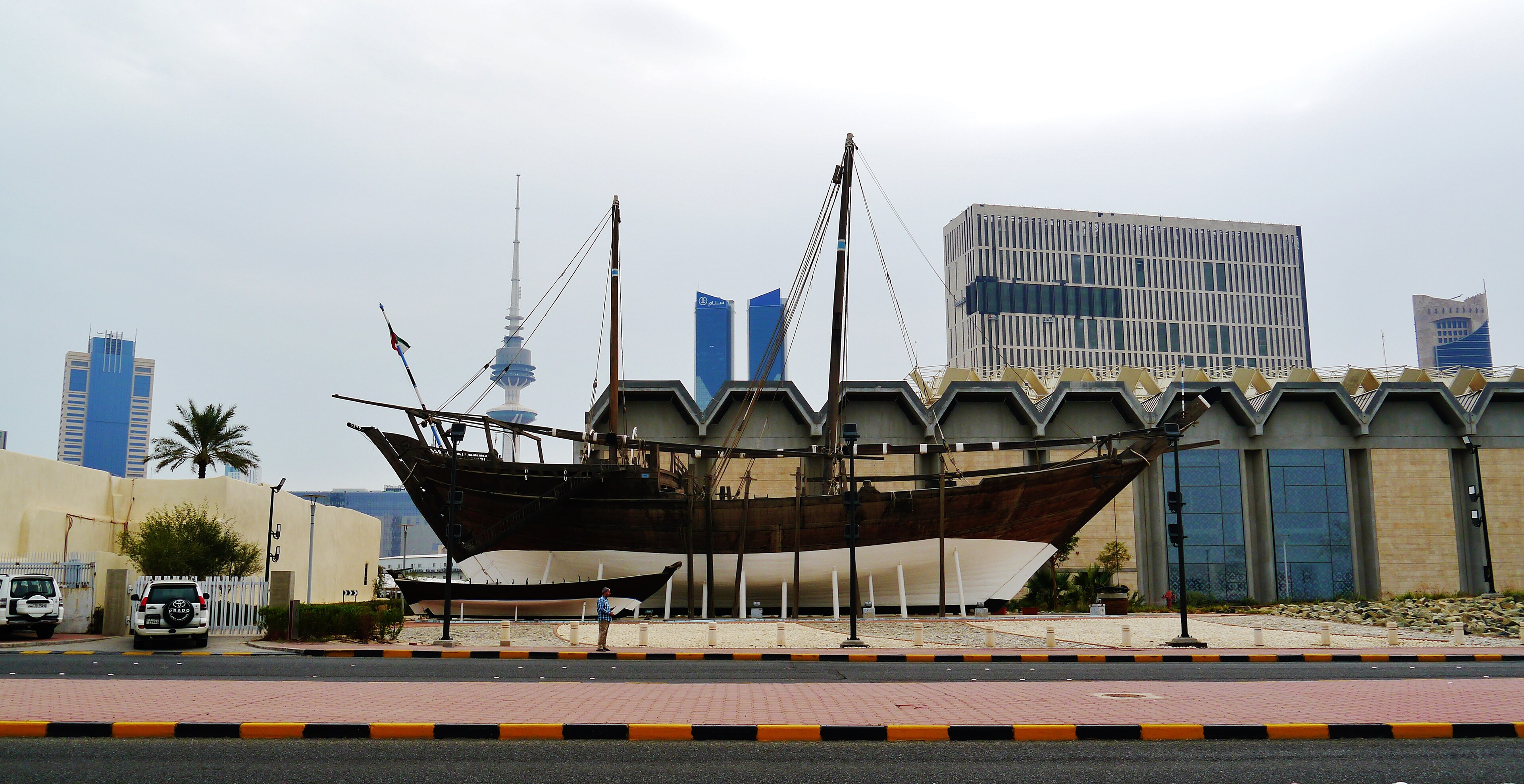 Traditional dhow displayed beside Arabian Gulf Street